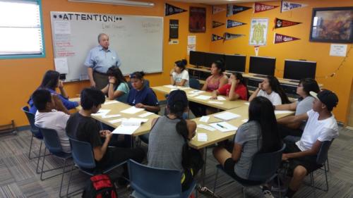 Dean Chavers discussing in front of students in a room
